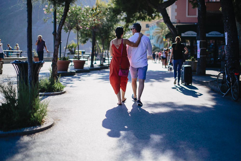 Engagement photographer cinque terre Italy, couple walking in the street in Monterosso al mare