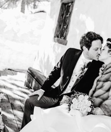 bride and groom kissing - winter wedding