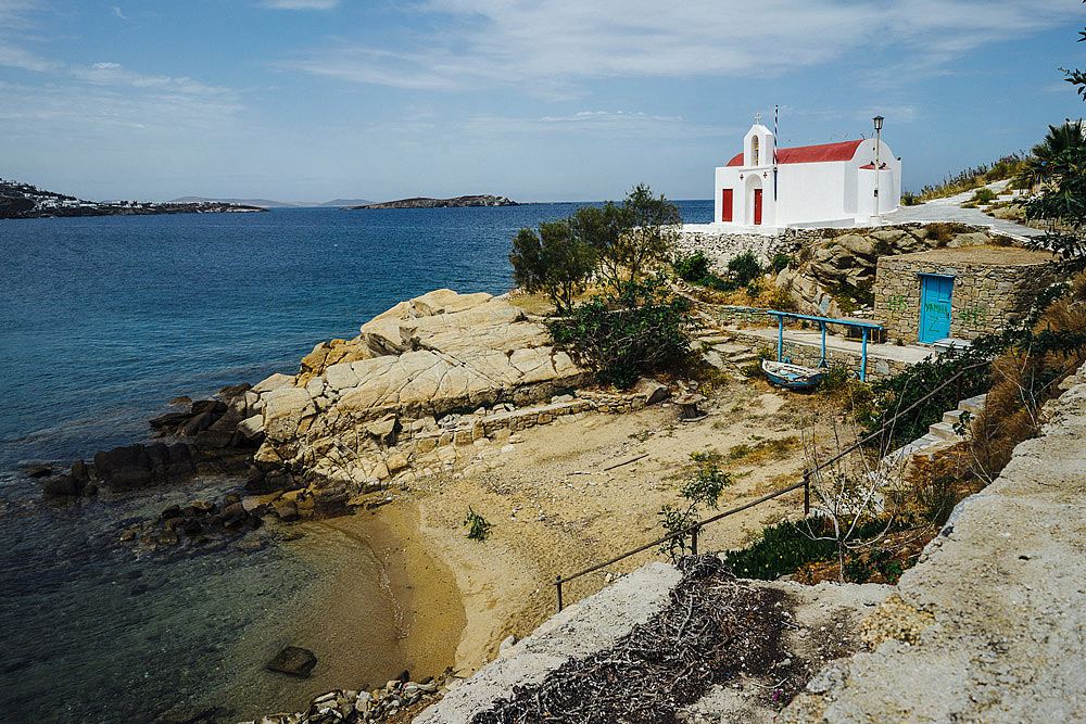 AGIOS SOSTIS BEACH COUPLE PORTRAIT IN MYKONOS EMANUELE & CAROL